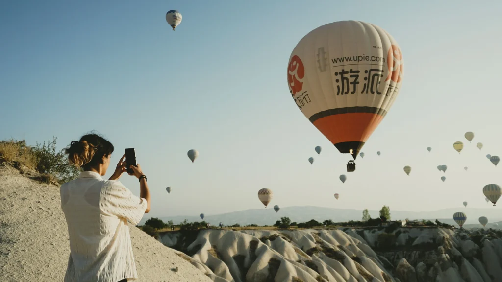 Traditional stone buildings and cave hotels carved into the volcanic tuff cliffs of Cappadocia